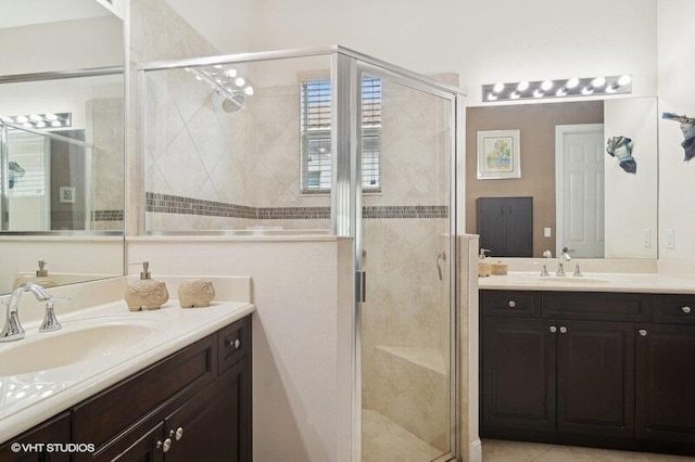 bathroom with walk in shower and vanity