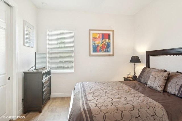 bedroom with light hardwood / wood-style flooring