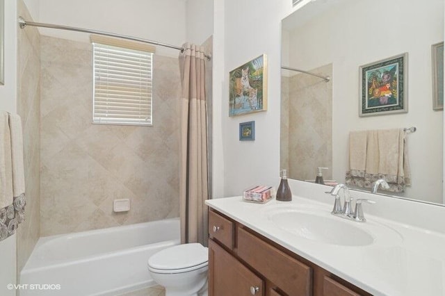 full bathroom with toilet, vanity, and shower / bath combo with shower curtain