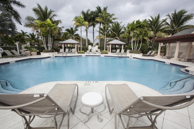 view of swimming pool featuring a gazebo and a patio