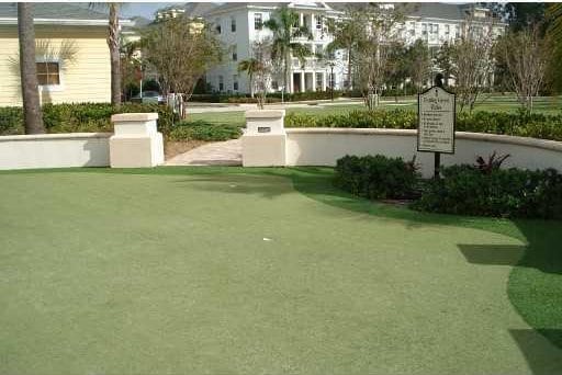 view of property's community featuring a lawn