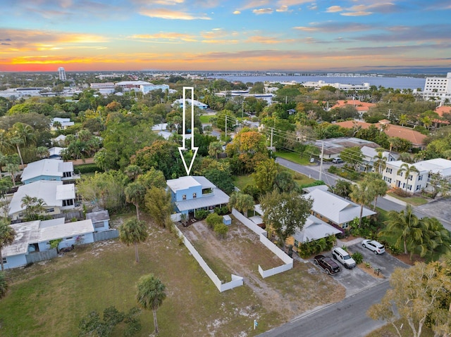 aerial view at dusk with a water view