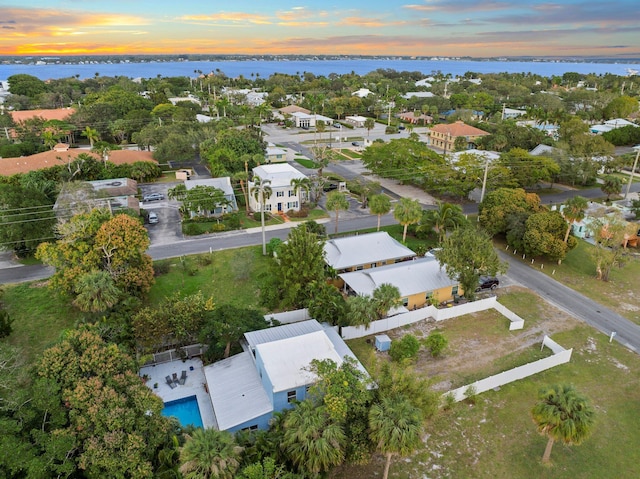 aerial view at dusk with a water view