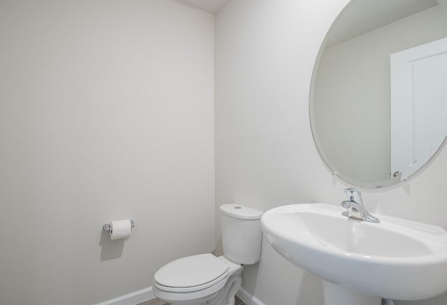 bathroom featuring sink and toilet