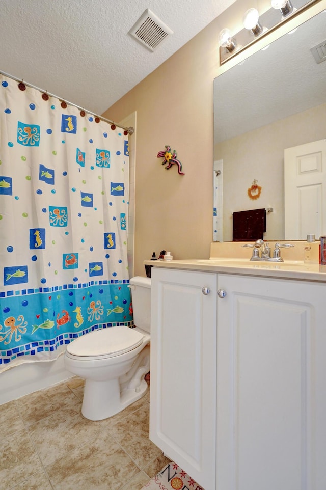 bathroom with vanity, toilet, a shower with shower curtain, and a textured ceiling