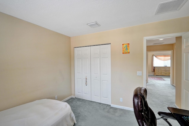 carpeted bedroom featuring a closet