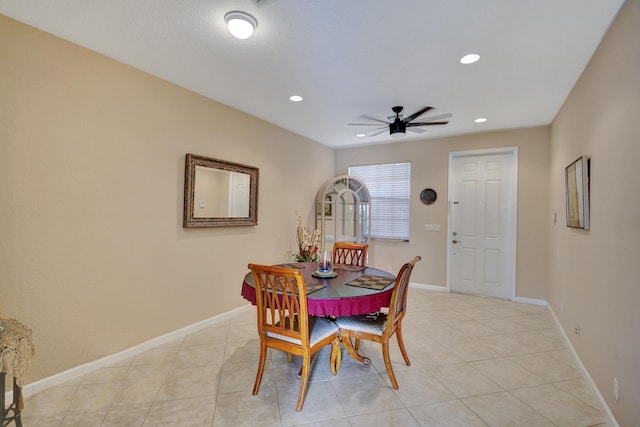 tiled dining area with ceiling fan