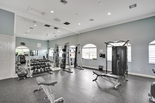 exercise room featuring ornamental molding