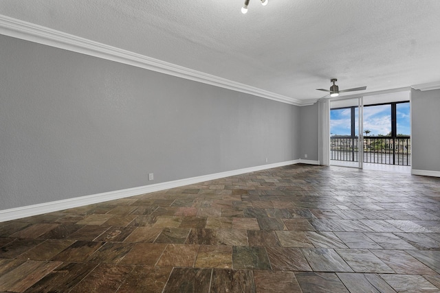 spare room with ceiling fan, expansive windows, crown molding, and a textured ceiling