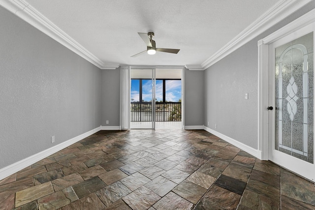 spare room featuring ceiling fan and crown molding