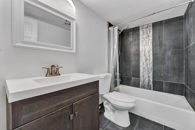 full bathroom featuring shower / bath combo with shower curtain, toilet, vanity, and tile patterned flooring