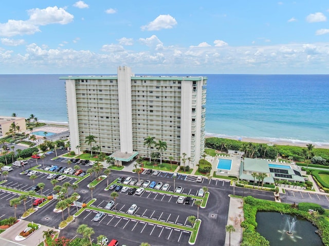 bird's eye view featuring a water view and a view of the beach