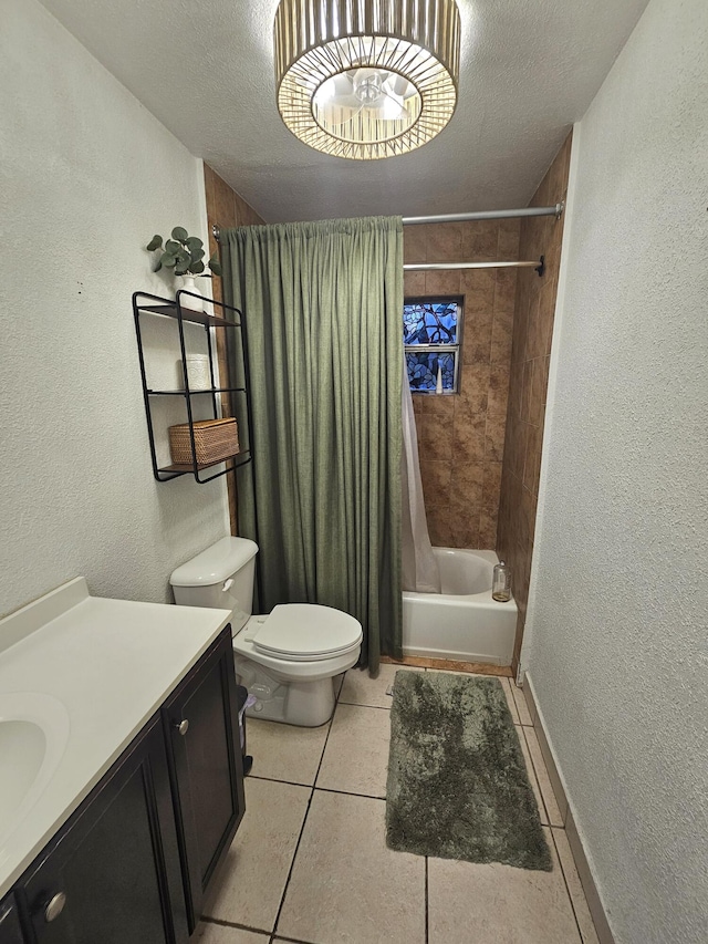 full bathroom with toilet, vanity, tile patterned flooring, a textured ceiling, and shower / bath combo with shower curtain