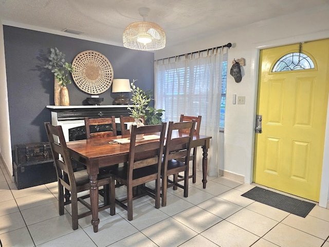 dining space featuring light tile patterned floors