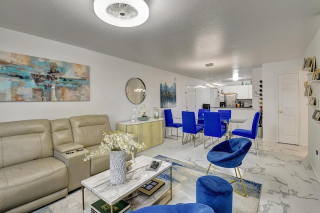 living room with a textured ceiling