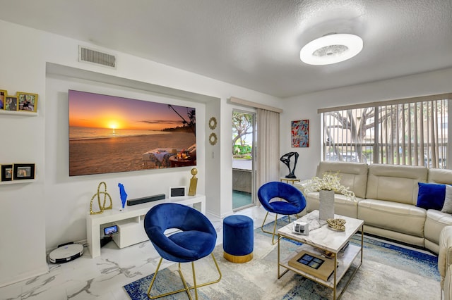 living room with a textured ceiling