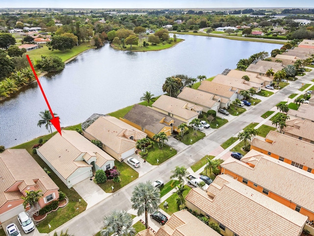 birds eye view of property featuring a water view