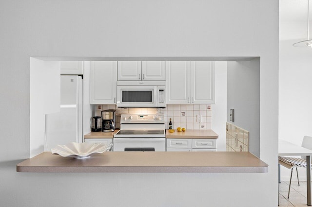 kitchen with white cabinetry, white appliances, light tile patterned floors, and backsplash