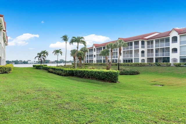 view of home's community with a lawn