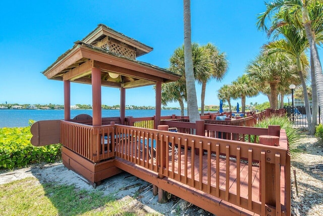 wooden deck featuring a water view