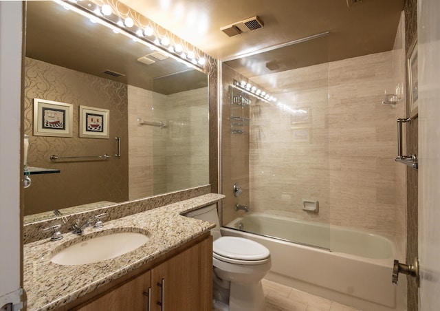 full bathroom with shower / bath combination, vanity, tile patterned flooring, and toilet