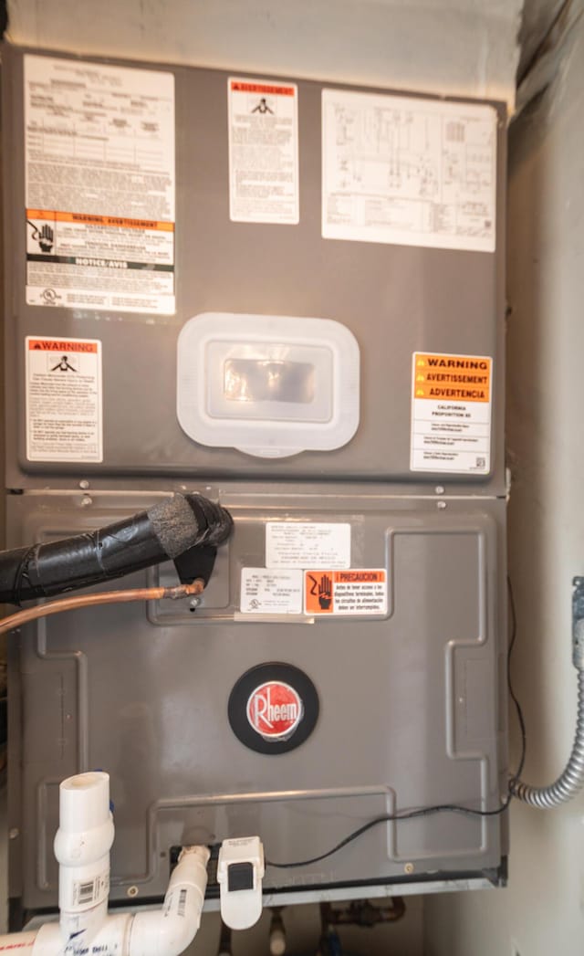 utility room with heating unit