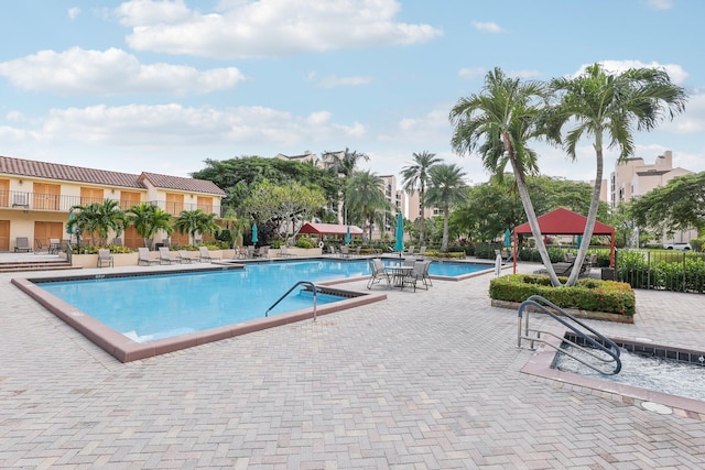 view of swimming pool with a gazebo and a patio