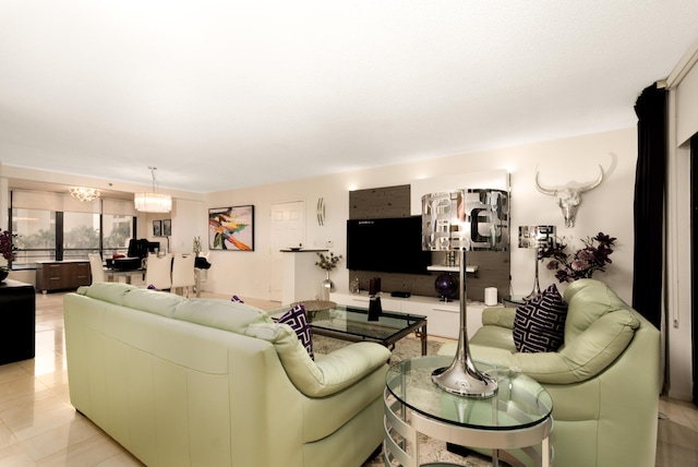 living room featuring an inviting chandelier and light tile patterned floors