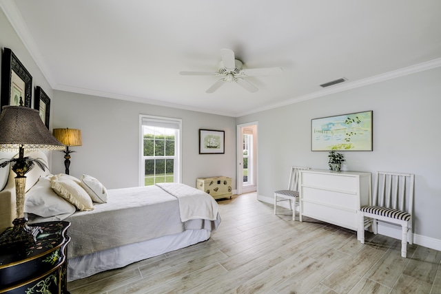 bedroom featuring ceiling fan, light hardwood / wood-style flooring, and ornamental molding