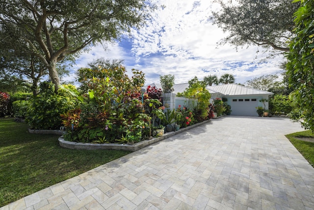 exterior space featuring a front yard and a garage