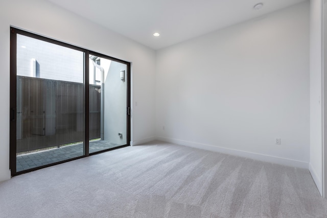 unfurnished room with light colored carpet