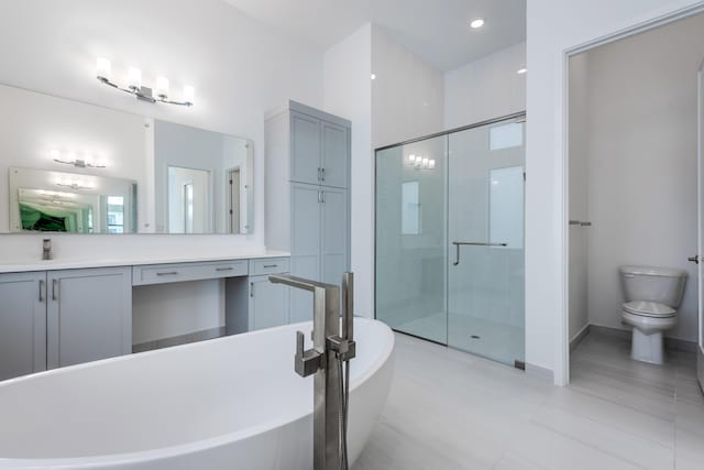 full bathroom featuring toilet, vanity, independent shower and bath, and tile patterned flooring