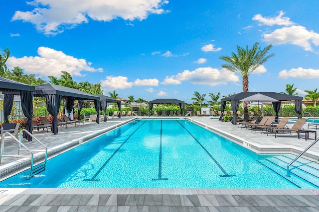 view of swimming pool with a gazebo and a patio