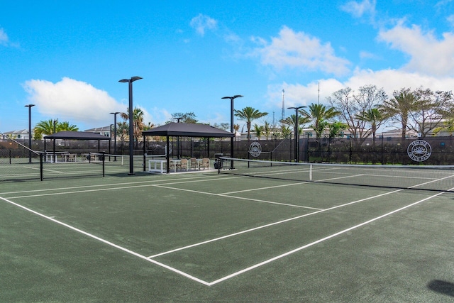 view of tennis court featuring a gazebo