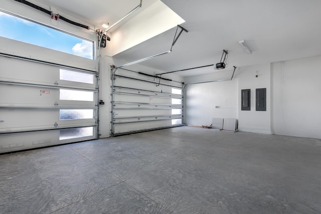 garage featuring a garage door opener and electric panel