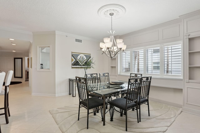 dining space with crown molding, a chandelier, a textured ceiling, and light tile patterned floors