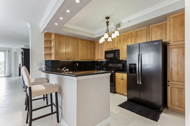 kitchen featuring a breakfast bar, crown molding, tasteful backsplash, kitchen peninsula, and black appliances