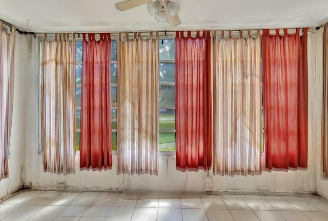 interior space featuring ceiling fan