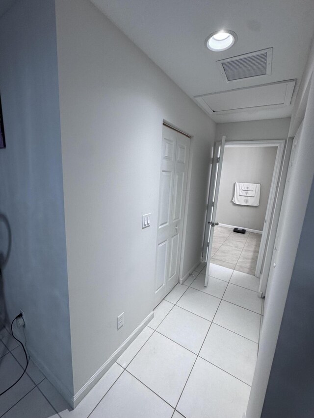 hallway featuring light tile patterned floors