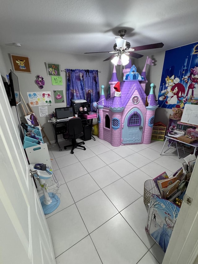 rec room featuring ceiling fan and tile patterned flooring