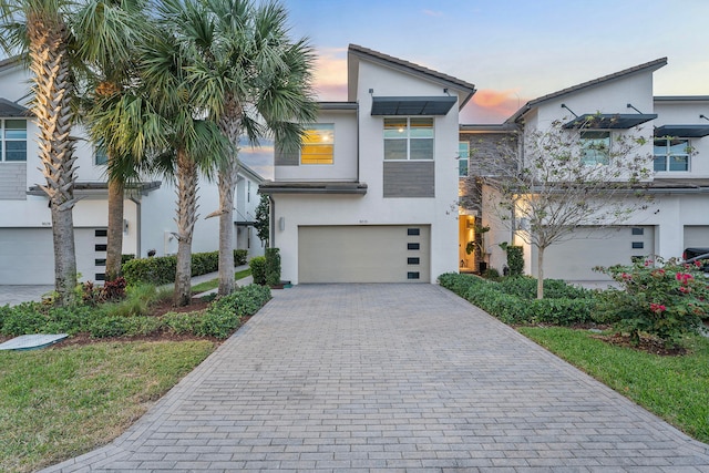 view of front of property with a garage