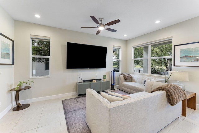 living room with ceiling fan and light tile patterned floors