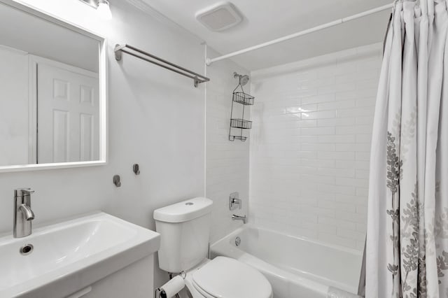 full bathroom featuring toilet, sink, and shower / bath combo with shower curtain