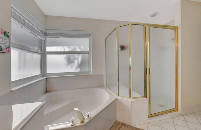 bathroom featuring separate shower and tub and tile patterned floors