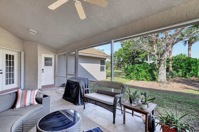 sunroom with vaulted ceiling and ceiling fan