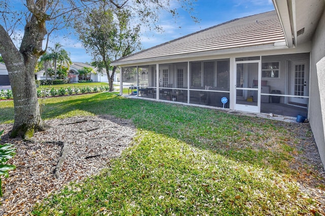 view of yard featuring a sunroom