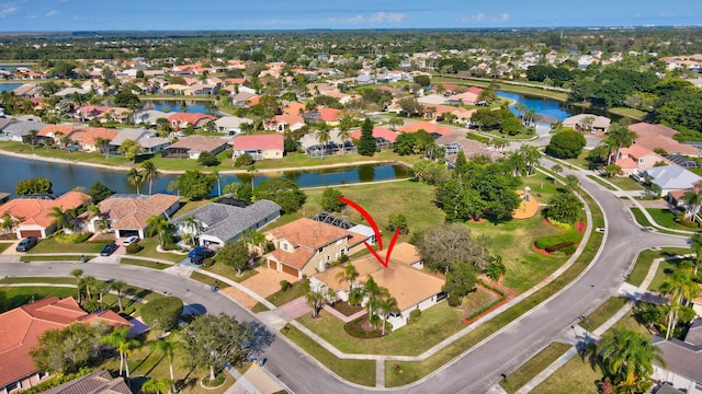 birds eye view of property featuring a water view