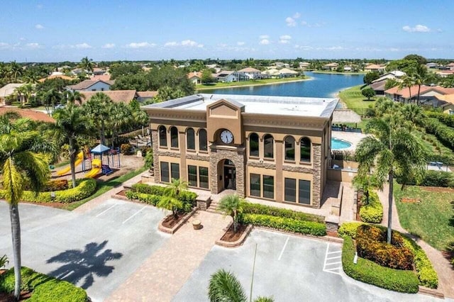 view of front of home with a water view