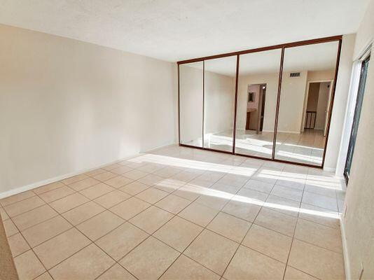 empty room with light tile patterned floors