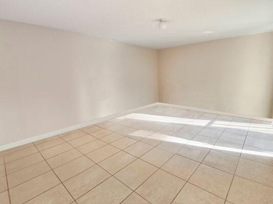 empty room featuring light tile patterned floors